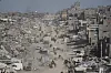 Displaced Palestinians fleeing Beit Lahia amid ongoing Israeli military operations in the Gaza Strip arrive in Jabalia, in the northern Gaza strip, on May 16. [AP/YONHAP]