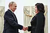 Russia's President Vladimir Putin, left, shakes hands with North Korean Foreign Minister Choe Son-hui during a meeting at the Kremlin in Moscow. [TASS]