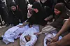 Palestinians mourn children from their families who were killed in Israeli airstrikes in Jabalia, in the northern Gaza Strip on May 14. [AP/YONHAP]