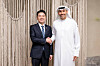 Kang Hoon-sik, President Lee Jae Myung's chief of staff, left, shakes hands with Khaldoon Khalifa Al Mubarak, chairman of Abu Dhabi's Executive Affairs Authority, during their meeting in Abu Dhabi, the United Arab Emirates, in this photo captured from Kang's Facebook on Feb. 26. [SCREEN CAPTURE]