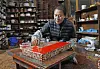 Sohn dabs juchil or red lacquer on his creation. [PARK SANG-MOON]