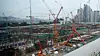 Workers operate at an apartment construction site in Seoul on Aug. 11, as the government begins a crackdown on illegal subcontracting at construction sites. [YONHAP]