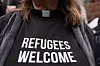Pastor Jennifer Castle joins others outside the U.S. District Court after a federal judge blocked President Donald Trump's effort to halt the nation's refugee admissions system on Feb. 25, 2025, in Seattle. [AP/YONHAP]