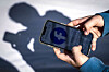 This photo taken on Oct. 24 shows the hands of a 14-year-old boy as he looks at social media on his mobile phone at his home near Gosford, Australia. Australia will ban young teenagers from social media on Dec. 10, launching a world-first crackdown designed to unglue children from addictive scrolling on apps including Facebook, Instagram and TikTok. [AFP/YONHAP]