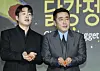 Ahn Jae-hong, left, and Ryu Seung-ryong pose with pieces of dakgangjeong during a press conference for 'Chicken Nugget' [NEWS1]