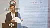 An FTC official gives a briefing on unfair terms of Tesla's sales contracts. [YONHAP]