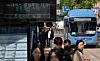 A delay notice for a bus due to the 'work-to-rule' strikes is seen at a bus station in Seoul on May 7. [YONHAP]