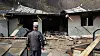 A man looks at a burnt house, which belongs to his mother on March 23, after a massive wildfire hit Sicheon-myeon in Sancheong County, South Gyeongsang from March 21. [NEWS1]