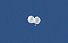 Balloons carrying trash fly above the Jonno District of Seoul after being launched by North Korea. [NEWS1]