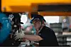 A laborer works on an assembly line during the organized press tour in the AVATR EV factory in Chongqing, China, May 20, 2025. AVATR Technology is a premium EV (electric vehicle) brand created through a joint venture led by Changan Automobile. [EPA/YONHAP]