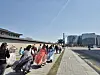 People in hanbok, traditional Korean clothing, stroll the sidewalk in Gwanghwamun Square, central Seoul on Apr. 6. [HAN EUN-HWA]