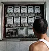 A citizen looks at electric monitors inside a multi-household building in Jongno District, central Seoul, on Sept. 22, 2024. [NEWS1]