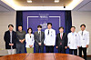 Suga of BTS, fourth from left, poses for photos with medical staff and researchers at Severance Hospital in western Seoul on June 23. [YONHAP]
