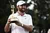 Scottie Scheffler of the United States poses with the Players Championship trophy after putting in to win on the 18th hole for his second consecutive tournament win at the Stadium Course at TPC Sawgrass on March 17 in Ponte Vedra Beach, Florida. [GETTY IMAGES]