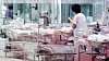 A staff member cares for newborns in a nursery at a postpartum care center in Seoul on Feb. 28, 2024. [YONHAP]