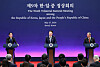 President Yoon Suk Yeol, center, speaks during a joint press briefing after holding a trilateral summit with Japanese Prime Minister Fumio Kishida, left, and Chinese Primer Li Qiang, right, at the Blue House in central Seoul on Monday. [JOINT PRESS CORPS]
