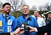 Former president Moon Jae-in, center, speaks to the press during an election campaign in Ulsan on April 2, 2024. [YONHAP]