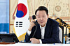 President Yoon Suk Yeol talks over the phone at his office in Seoul. [PRESIDENTIAL OFFICE]