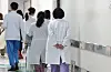 Medical staff walk inside Seoul National University Hospital in Jongno District, central Seoul on Feb. 25. [YONHAP]