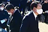 Then-liberal Democratic Party presidential candidate Lee Jae-myung, left, and then-conservative People Power Party presidential candidate Yoon Suk Yeol attend a ceremony marking the 89th anniversary of the death of independence activist Yun Bong-gil at Hyochang Park in Yongsan District, central Seoul, on Dec. 19, 2021. [NEWS1]
