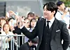 Actor Ahn Jae-hong walks down the Seoul International Drama Awards' purple carpet in Yeouido, western Seoul, on Wednesday. [NEWS1]