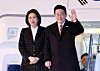 President Lee Jae Myung, right, and first lady Kim Hea Kyung wave to well-wishers aboard Air Force One at Kansai International Airport in Osaka, Japan, on Jan. 14 before returning home after concluding his visit to Japan for a bilateral summit. [YONHAP]