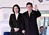 President Lee Jae Myung, right, and first lady Kim Hea Kyung wave to well-wishers aboard Air Force One at Kansai International Airport in Osaka, Japan, on Jan. 14 before returning home after concluding his visit to Japan for a bilateral summit. [YONHAP]