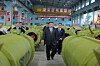 North Korean leader Kim Jong-un, center, inspects major munitions factories while calling for expanding the production of missiles and shells, in this photo carried by the North's official Korean Central News Agency on Dec. 26. [KOREAN CENTRAL NEWS AGENCY]