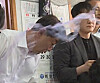 Jeonju Mayor Woo Beom-ki is splashed with water during a public discussion on the proposed Wanju-Jeonju municipal merger at a restaurant in Wanju County, North Jeolla, on July 25. [YONHAP]