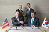 Bill Gates, left in the second row, founder and chairman of TerraPower and Chung Ki-sun, right in the second row, executive vice chairman of HD Hyundai take a commemorative photo after a signing ceremony marking the two companies' partnership to commercialize Natrium reactors in March. [HD HYUNDAI]