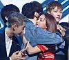 SHINee's Key, left, and f(x)'s Luna hug each other during the ending stage of a weekly music program in 2015. [SCREEN CAPTURE]