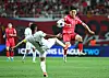 Korea's Hwang In-beom, right, vies for the ball during a 2026 World Cup qualifier against Palestine at Seoul World Cup Stadium in western Seoul on Sept. 5. [YONHAP]