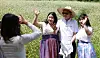 Culture Minster Yu, middle, takes pictures with tourists among buckwheat flowers in Menge Village, Andong, on Wednesday. [MINISTRY OF CULTURE, SPORTS AND TOURISM]
