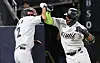 Mel Rojas Jr. of the KT Wiz, right, celebrates with teammate Sim Woo-jun after hitting a come-from-behind three-run home run against the SSG Landers in the fifth-place payoff game at Suwon KT Wiz Park in Suwon, Gyeonggi on Tuesday. [YONHAP]