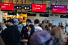 Passengers stand in front of check-in desks at Brussels Airport, where dozens of flights were canceled following a cyberattack affecting multiple airports in Europe, in Brussels, Belgium, on Spet. 22. [EPA/YONHAP]