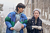 Actor Youn Yuh-jung, right, plays Min-seo, a world-renown architect who owns a pet dog, in the upcoming film 'Dog Days.' [CJ ENM]