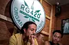 A tourist smokes a cannabis cigarette after purchasing it inside the RG420 cannabis store, at Khaosan Road, one of the favourite tourist spots in Bangkok, Thailand, July 31, 2022. [REUTERS/YONHAP]