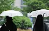 As rain falls across Seoul and the surrounding capital region on May 1, people walk with umbrellas near Coex in Gangnam District, southern Seoul. [NEWS1]