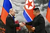 Russian President Vladimir Putin, left, and North Korean leader Kim Jong-un exchange documents during a signing ceremony of the new partnership in Pyongyang, North Korea, on June 19, 2024. [AP/YONHAP]