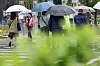 As rain falls across Seoul and the surrounding capital region on May 1, people walk with umbrellas near Jonggak Station intersection in Jongno District, central Seoul. [NEWS1]