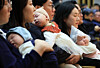 Families of Booyoung Group employees who received childbirth incentives attend an annual company ceremony and childbirth support event at the Booyoung Taepyeong Building in Jung District, central Seoul, on Feb. 5. [YONHAP]