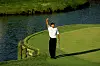 Tiger Woods celebrates making his “better than most” putt at the 17th hole during the third round of The Players Championship at the TPC Stadium course on March 24, 2001 in Ponte Vedra Beach, Florida. [GETTY IMAGES]