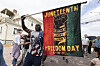 Robert Reid holds a flag during a Juneteenth celebration at the African Burying Ground Memorial Park on June 19 in Portsmouth, New Hampshire. [AP/YONHAP]
