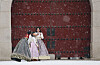 Tourists in hanbok, or Korean traditional dress, take photos near Gwanghwamun in Jongno District, central Seoul, as snow falls in the area on Tuesday. [YONHAP]
