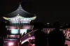 Participants of Gyeongbok Palace's Starlight Night Tour enjoy the night view of the palace on April 2, 2024. [NEWS1]