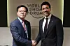 Trade Minister Yeo Han-koo, left, shakes hands with his Canadian counterpart, Maninder Sidhu, at the 2026 World Economic Forum in Switzerland on Jan. 20. [YONHAP]