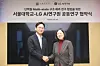LG AI Research President Bae Kyung-hoon, left, and Seoul National University Professor Baek Min-kyung take a commemorative photo after signing a joint agreement at the LG Science Park in western Seoul on Feb. 5. [LG]