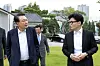 President Yoon Suk Yeol, left, and People Power Party leader Han Dong-hoon, right, walk on the lawn of the Pine Grass reception hall inside the presidential complex in Yongsan District, central Seoul, on Monday afternoon. [PRESIDENTIAL OFFICE]