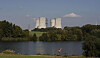A man fishes with the towering Dukovany nuclear power plant in the background, in Dukovany, Czech Republic, Sept. 27, 2011. [AP/YONHAP]