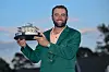 Scottie Scheffler poses with the winner's trophy as the 2024 Masters champion after the final round of the Masters Tournament at Augusta National Golf Club in Augusta, Georgia on April 14, 2024. [GETTY IMAGES]